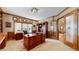 Home office features wooden built-in shelving and cabinets, a large wooden desk, and lots of natural light at 6414 E Stanford Ave, Cherry Hills Village, CO 80111