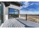 Balcony featuring wood decking, modern railing, and a view of the surrounding open landscape at 1740 Joseph Cir, Elizabeth, CO 80107