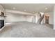 Spacious basement with stone fireplace, carpet, staircase, and potential for entertainment at 1740 Joseph Cir, Elizabeth, CO 80107