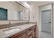 Double vanity bathroom featuring modern fixtures, a large mirror, and ample lighting at 1740 Joseph Cir, Elizabeth, CO 80107