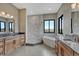 Luxurious bathroom with soaking tub, walk-in shower, dual windows and granite countertops at 1740 Joseph Cir, Elizabeth, CO 80107