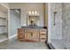 Bathroom vanity featuring granite counters, wood cabinets, and modern fixtures at 1740 Joseph Cir, Elizabeth, CO 80107