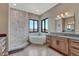 Luxurious bathroom with soaking tub, walk-in shower, dual windows and granite countertops at 1740 Joseph Cir, Elizabeth, CO 80107