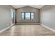 Bright, spacious bedroom featuring large windows, modern floors, and vaulted ceiling at 1740 Joseph Cir, Elizabeth, CO 80107