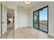 Bedroom featuring sliding doors to a balcony, connecting to the kitchen area at 1740 Joseph Cir, Elizabeth, CO 80107