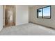 Bright bedroom featuring neutral walls, carpet, and natural light from a window at 1740 Joseph Cir, Elizabeth, CO 80107