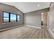 Bright, spacious bedroom featuring large windows, modern floors, and vaulted ceiling at 1740 Joseph Cir, Elizabeth, CO 80107