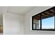 A bedroom window reveals views of a stone facade and the scenic exterior landscape at 1740 Joseph Cir, Elizabeth, CO 80107