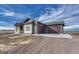 Exterior view of a new modern home with three-car garage and concrete driveway at 1740 Joseph Cir, Elizabeth, CO 80107