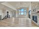 Living space features hardwood floors, fireplace, and large windows providing ample natural light at 1740 Joseph Cir, Elizabeth, CO 80107
