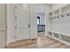 Welcoming mudroom features built-in cubbies, hooks, and durable flooring for easy organization at 1740 Joseph Cir, Elizabeth, CO 80107