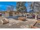Spacious backyard with pergola, garden boxes, and potential fire pit area at 2955 E Caley Ave, Centennial, CO 80121