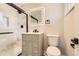 Modern bathroom features a tiled shower, sleek vanity, and contemporary lighting at 2955 E Caley Ave, Centennial, CO 80121