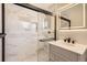 Updated bathroom features a glass shower, sleek vanity, and contemporary lighting at 2955 E Caley Ave, Centennial, CO 80121