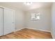 Bedroom with natural light, wood floors, and a closet for storage at 2955 E Caley Ave, Centennial, CO 80121
