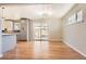 Bright dining area with hardwood floors and a sliding glass door that leads to the backyard at 2955 E Caley Ave, Centennial, CO 80121