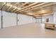 Spacious detached garage with multiple garage doors and ceiling fans at 2955 E Caley Ave, Centennial, CO 80121