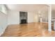 Spacious living room with hardwood floors, stone fireplace and ample natural light at 2955 E Caley Ave, Centennial, CO 80121