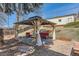 Outdoor pergola with curtains, seating, and stylish design in backyard at 2955 E Caley Ave, Centennial, CO 80121