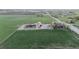 Sweeping aerial view of farmland featuring barns, silos and ample space for various agricultural activities at 1805 W County Road 8, Berthoud, CO 80513