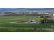 Scenic aerial shot of farm land, buildings, and surrounding greenery with picturesque landscape at 1805 W County Road 8, Berthoud, CO 80513