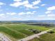 Expansive aerial view of land with a beautiful view of the horizon and large open green field at 1805 W County Road 8, Berthoud, CO 80513