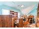 Spacious attic area with blue walls, multiple shelves, and unfinished drywall sections at 1805 W County Road 8, Berthoud, CO 80513