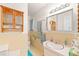 Bathroom with tiled wall, vanity, and mirror at 1805 W County Road 8, Berthoud, CO 80513
