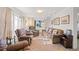 Cozy living room with arm chairs, sofa, and natural light at 1805 W County Road 8, Berthoud, CO 80513