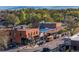 Vibrant street scene with a variety of storefronts, bustling with activity and parked cars at 1805 W County Road 8, Berthoud, CO 80513