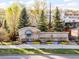 Beautiful welcome sign with vibrant flowers and lush trees enhancing the entrance at 1805 W County Road 8, Berthoud, CO 80513