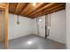 Unfinished basement with exposed ceiling, plumbing, and concrete floor, ready to be customized at 12501 Randolph Pl, Denver, CO 80239