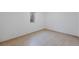 Bright basement with tile floor and a window, ready for finishing and customization at 12501 Randolph Pl, Denver, CO 80239
