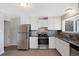Updated kitchen featuring stainless steel appliances, sleek countertops, and ample cabinet space at 12501 Randolph Pl, Denver, CO 80239