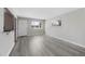Bright living room with modern gray flooring, neutral paint, and ample natural light at 12501 Randolph Pl, Denver, CO 80239
