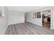 Open-concept living area flowing into a kitchen with modern appliances and finishes at 12501 Randolph Pl, Denver, CO 80239