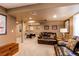 Spacious basement featuring a lounge area, a pool table, and neutral-colored walls at 5473 W Prentice Ct, Littleton, CO 80123