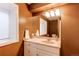 Well-lit bathroom features a vanity sink, neutral color scheme, and good lighting at 5473 W Prentice Ct, Littleton, CO 80123