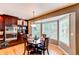 Cozy dining room with a bay window and dark wood furniture at 5473 W Prentice Ct, Littleton, CO 80123