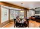 Bright dining area featuring a bay window with backyard views at 5473 W Prentice Ct, Littleton, CO 80123