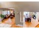 View of the dining and living room featuring hardwood floors, lots of light and views, and traditional styling at 5473 W Prentice Ct, Littleton, CO 80123