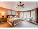 Spacious main bedroom with a cozy sitting area by the window and plush decor at 5473 W Prentice Ct, Littleton, CO 80123