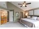 View of a main bedroom with elegant decor, a ceiling fan, neutral colors, and great natural light at 5473 W Prentice Ct, Littleton, CO 80123