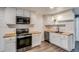 Modern kitchen featuring stainless steel appliances and butcher block countertops at 2980 S Parker Ct, Aurora, CO 80014