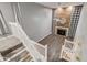 Open floor plan with hardwood floors and a red brick fireplace with decorative mantle and light gray walls at 2980 S Parker Ct, Aurora, CO 80014