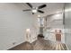 A view of the staircase with white wood trim and luxury vinyl plank flooring and a partial view of the basement at 2980 S Parker Ct, Aurora, CO 80014