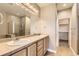 The primary bathroom boasts double sinks, tile floors, a walk-in shower and a closet at 10311 Belvedere Ln, Lone Tree, CO 80124