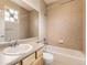 Well-lit bathroom with a tub and shower combination, tiled walls, and a vanity with a sink and ample counter space at 10311 Belvedere Ln, Lone Tree, CO 80124