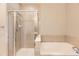 The primary bathroom offers a glass enclosed shower with a built-in tub at 10311 Belvedere Ln, Lone Tree, CO 80124