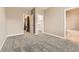 Spacious bedroom with neutral walls and plush carpeting, featuring easy access to the en-suite bathroom and walk-in closet at 10311 Belvedere Ln, Lone Tree, CO 80124